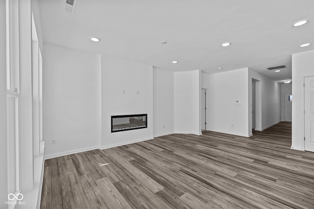 unfurnished living room with hardwood / wood-style floors