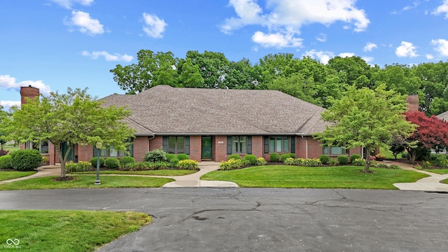 316 Northpointe Ct, Danville, IN 46122 - view of front of property with brick siding, a front lawn, and a chimney