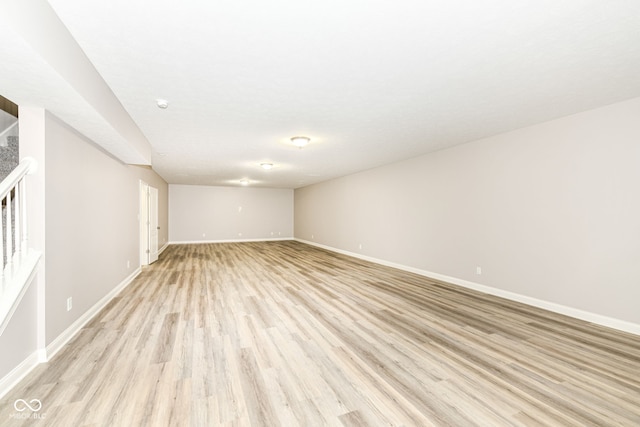 spare room with light wood-type flooring