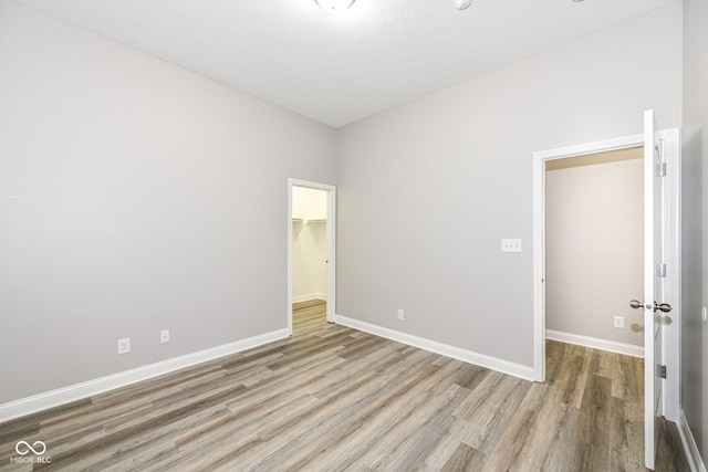 unfurnished room featuring light hardwood / wood-style flooring