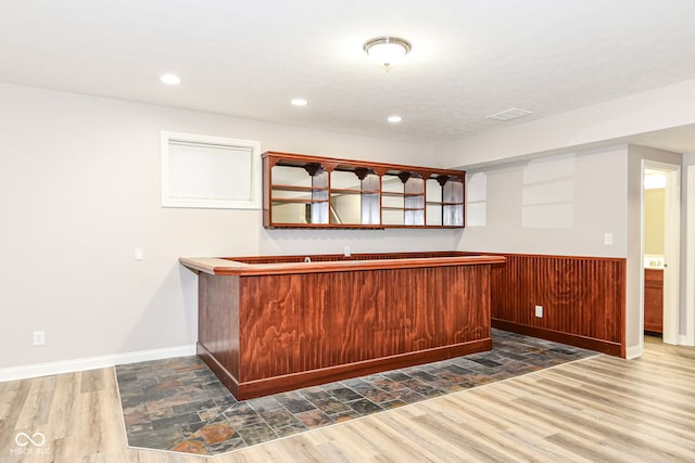 bar featuring dark hardwood / wood-style floors