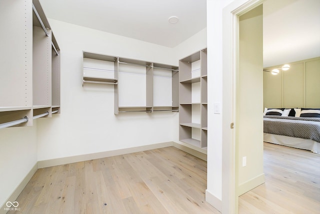 walk in closet featuring light wood-type flooring