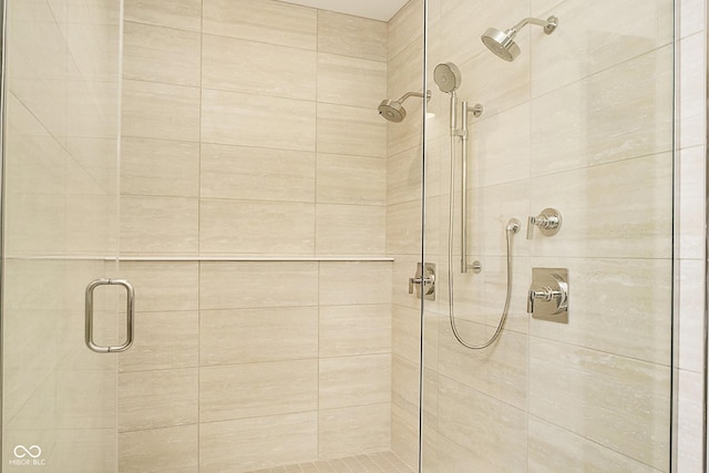 bathroom featuring a shower with door