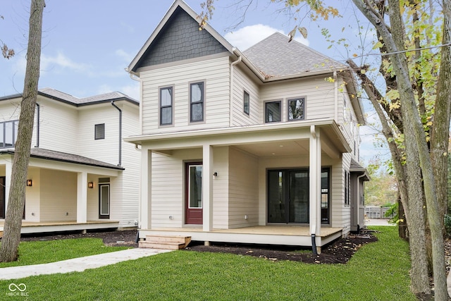 view of front facade featuring a front yard and covered porch