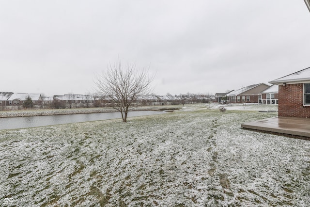 view of yard featuring a deck with water view