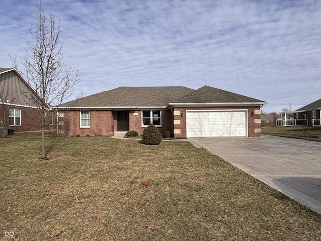 view of front of house with a garage and a front yard