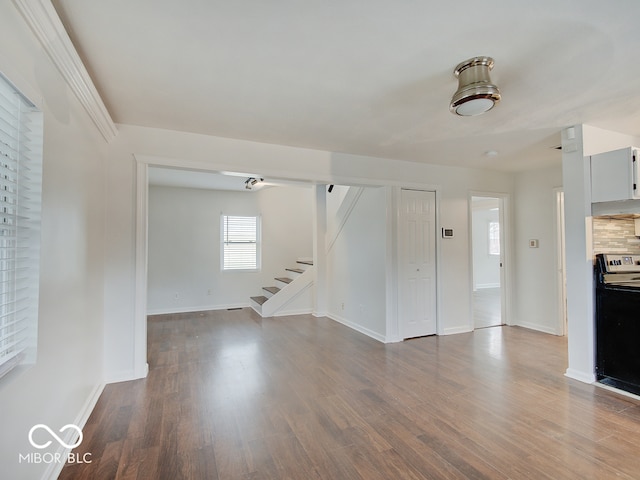 unfurnished living room featuring hardwood / wood-style floors