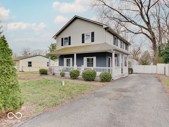 view of front of property with a porch and a front lawn