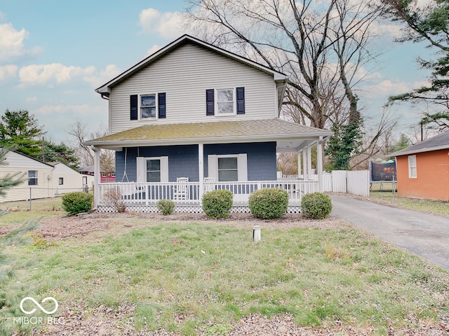 view of front of house with a porch and a front yard