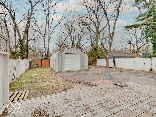 wooden deck featuring a storage shed