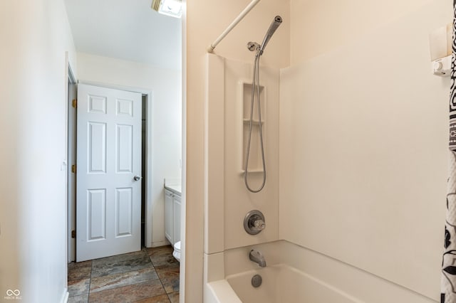 full bathroom featuring shower / washtub combination, vanity, and toilet