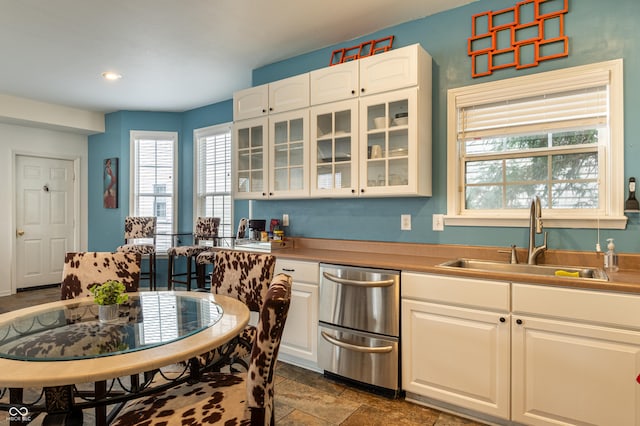 kitchen with white cabinetry and sink