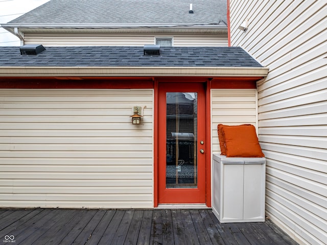 property entrance with a deck