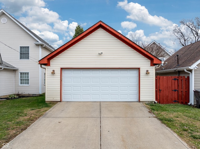 garage featuring a lawn