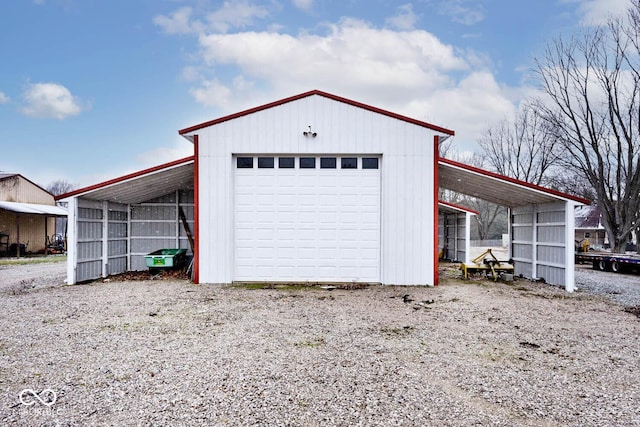 garage featuring a carport