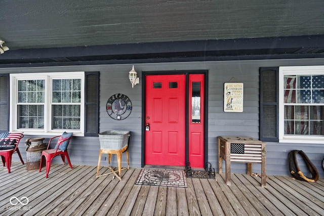 view of exterior entry with a porch