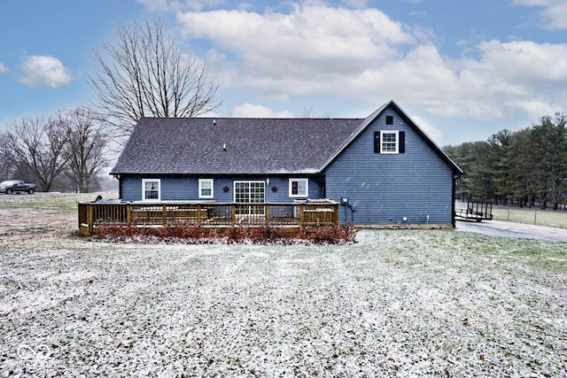 back of house featuring a deck