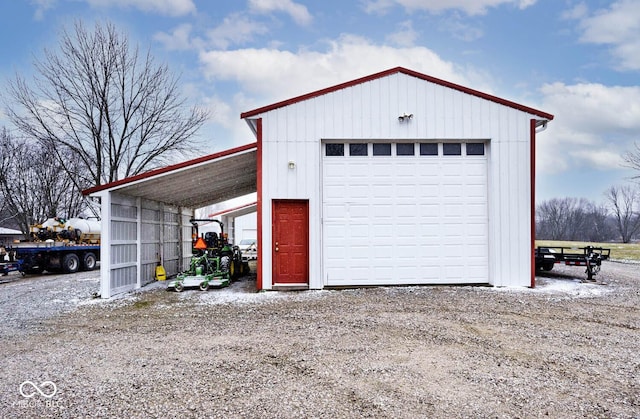 garage featuring a carport