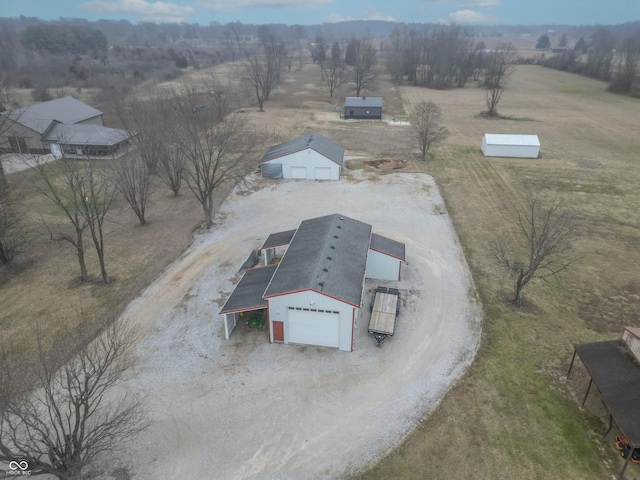 birds eye view of property featuring a rural view