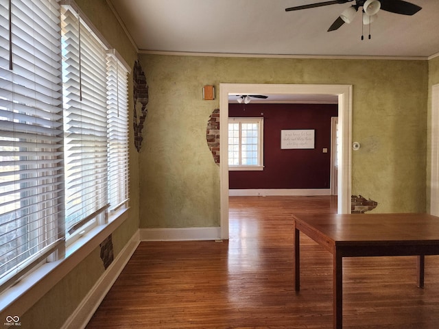 corridor featuring hardwood / wood-style flooring and crown molding