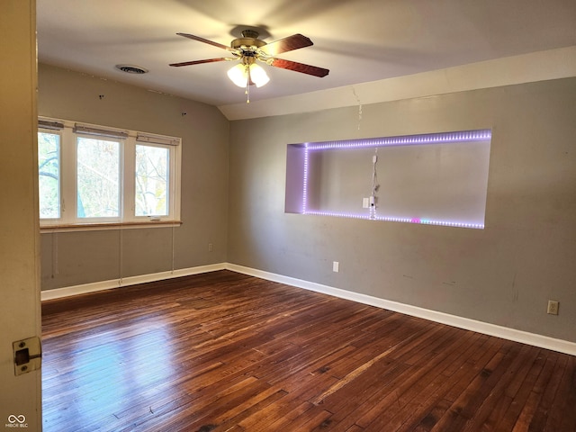 empty room with hardwood / wood-style floors and ceiling fan