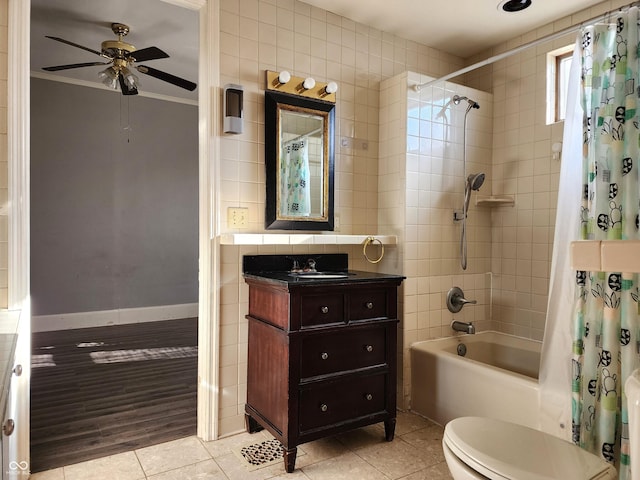 full bathroom with shower / bath combo with shower curtain, vanity, ornamental molding, and tile patterned flooring