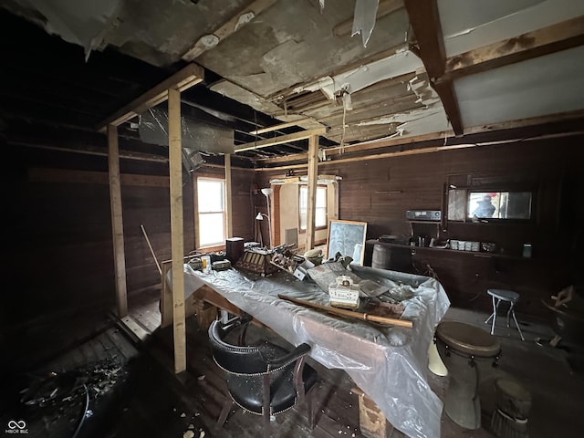 miscellaneous room with wood walls