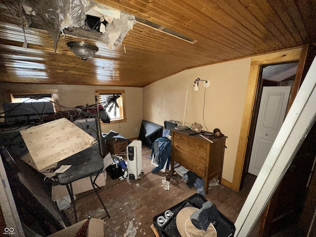 interior space with dark wood-type flooring, wooden ceiling, and vaulted ceiling