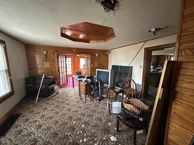 interior space featuring french doors and wood walls