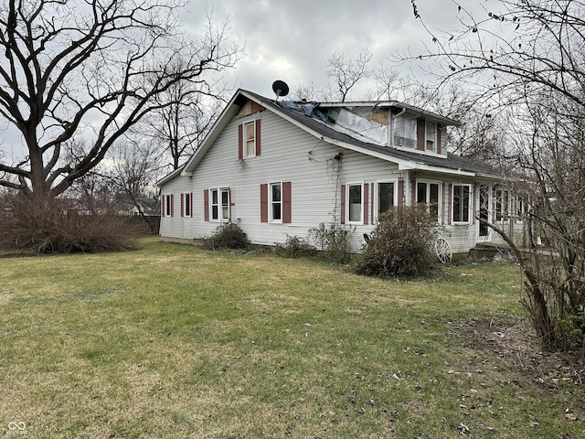 view of side of property with a yard