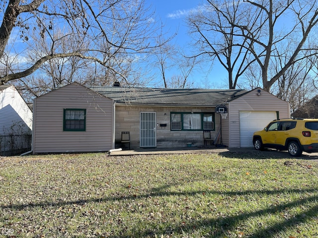 view of front facade with a front yard and a garage