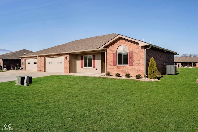 ranch-style home featuring central AC unit, a garage, and a front lawn