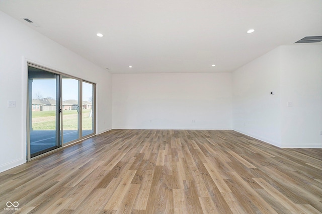 unfurnished room featuring light wood-type flooring