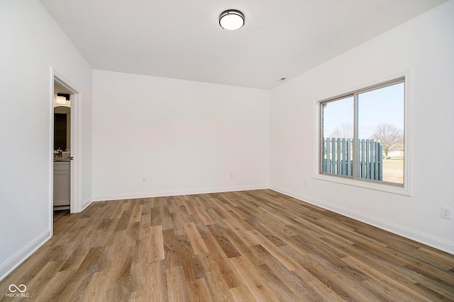 empty room featuring hardwood / wood-style floors