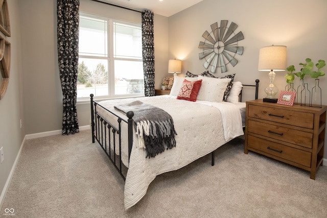 bedroom with light colored carpet