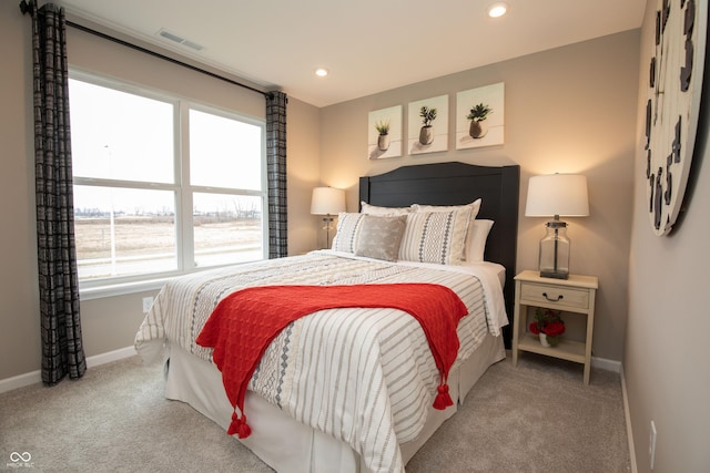 bedroom with light colored carpet