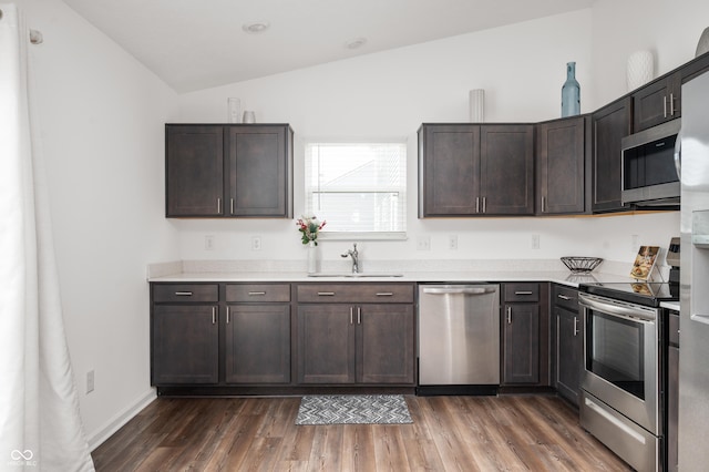 kitchen with dark brown cabinetry, sink, and stainless steel appliances