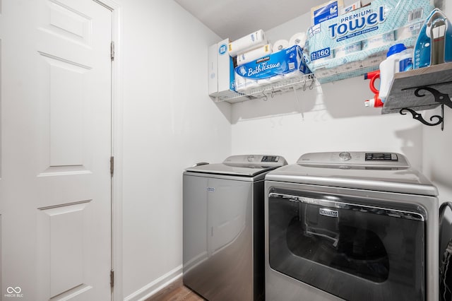 laundry area featuring hardwood / wood-style flooring and washer and clothes dryer