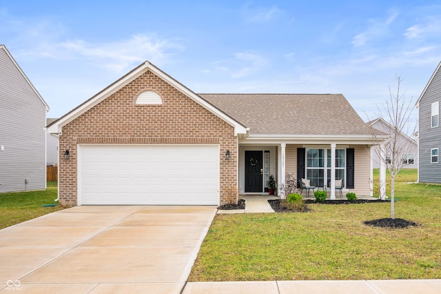 view of front of property with a porch, a front yard, and a garage