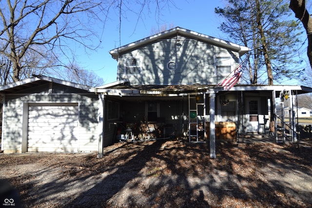 view of front of home featuring covered porch and a garage