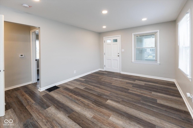 spare room featuring dark hardwood / wood-style flooring