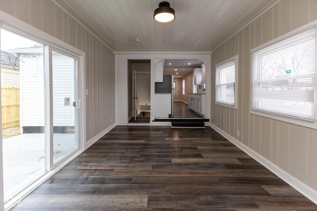 hallway with wood ceiling and dark hardwood / wood-style floors