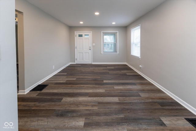 entrance foyer featuring dark hardwood / wood-style floors