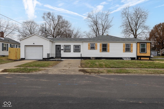 view of front facade with a front yard and a garage