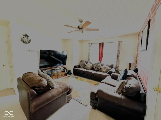 carpeted living room with ceiling fan