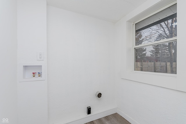 clothes washing area featuring washer hookup and hardwood / wood-style flooring