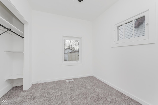 spacious closet with light colored carpet