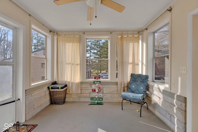 sunroom / solarium featuring ceiling fan and a healthy amount of sunlight