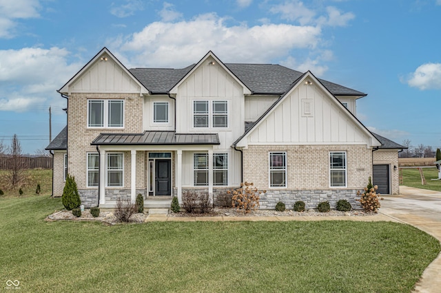 view of front of property featuring a garage and a front yard