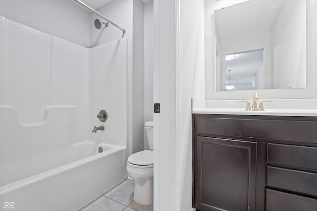 full bathroom with toilet, vanity, tile patterned floors, and washtub / shower combination